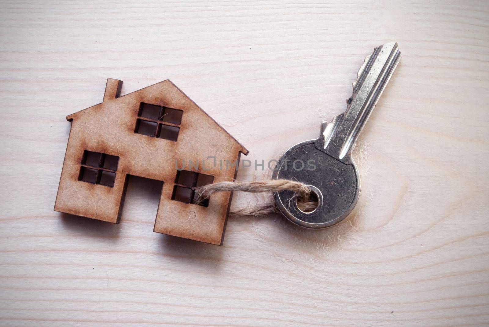 Key attached to a small house 