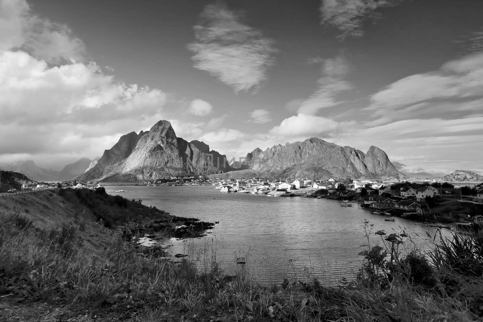Norway village Reine on a fjord. Nordic sunny summer day. Lofoten Norway islands. Black and white