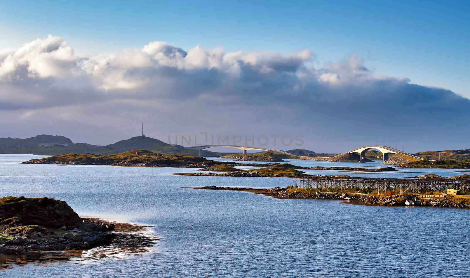 Norway road and bridges on coastline of a fjord. Nordic sunny summer day. Lofoten Norway islands.