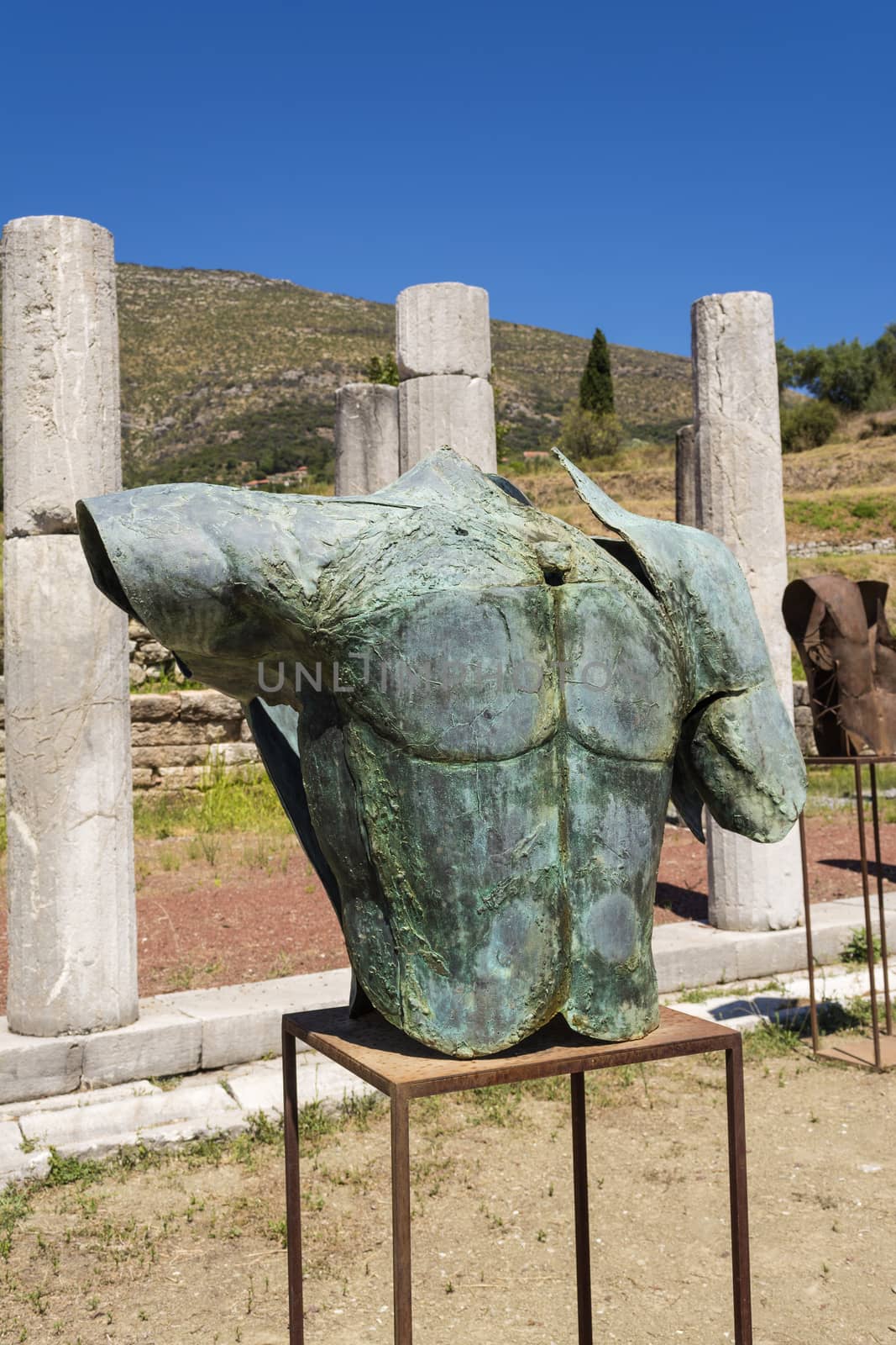 Metallic headless statue in the ancient Greek city of Messinia, Greece by ankarb