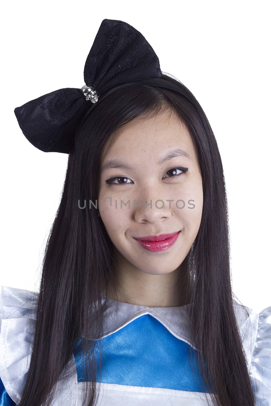 Young girl in the image of Alice on a white background