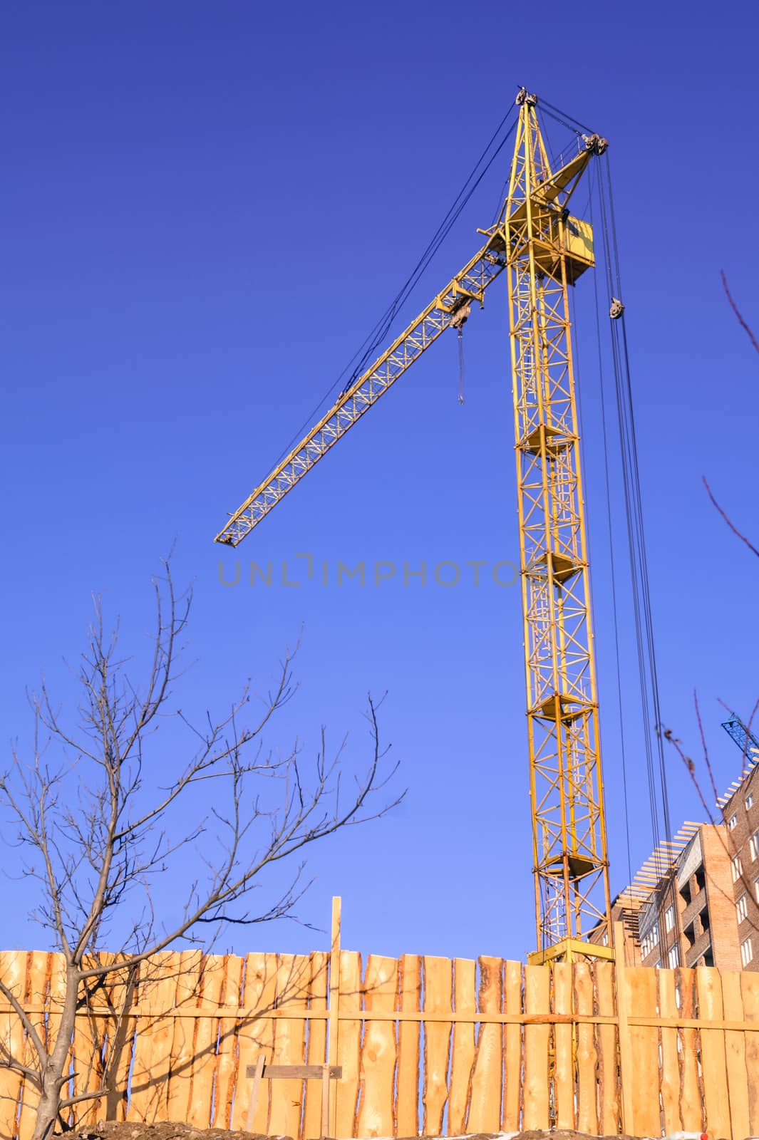 construction crane against the sky heavy equipment by Oleczka11