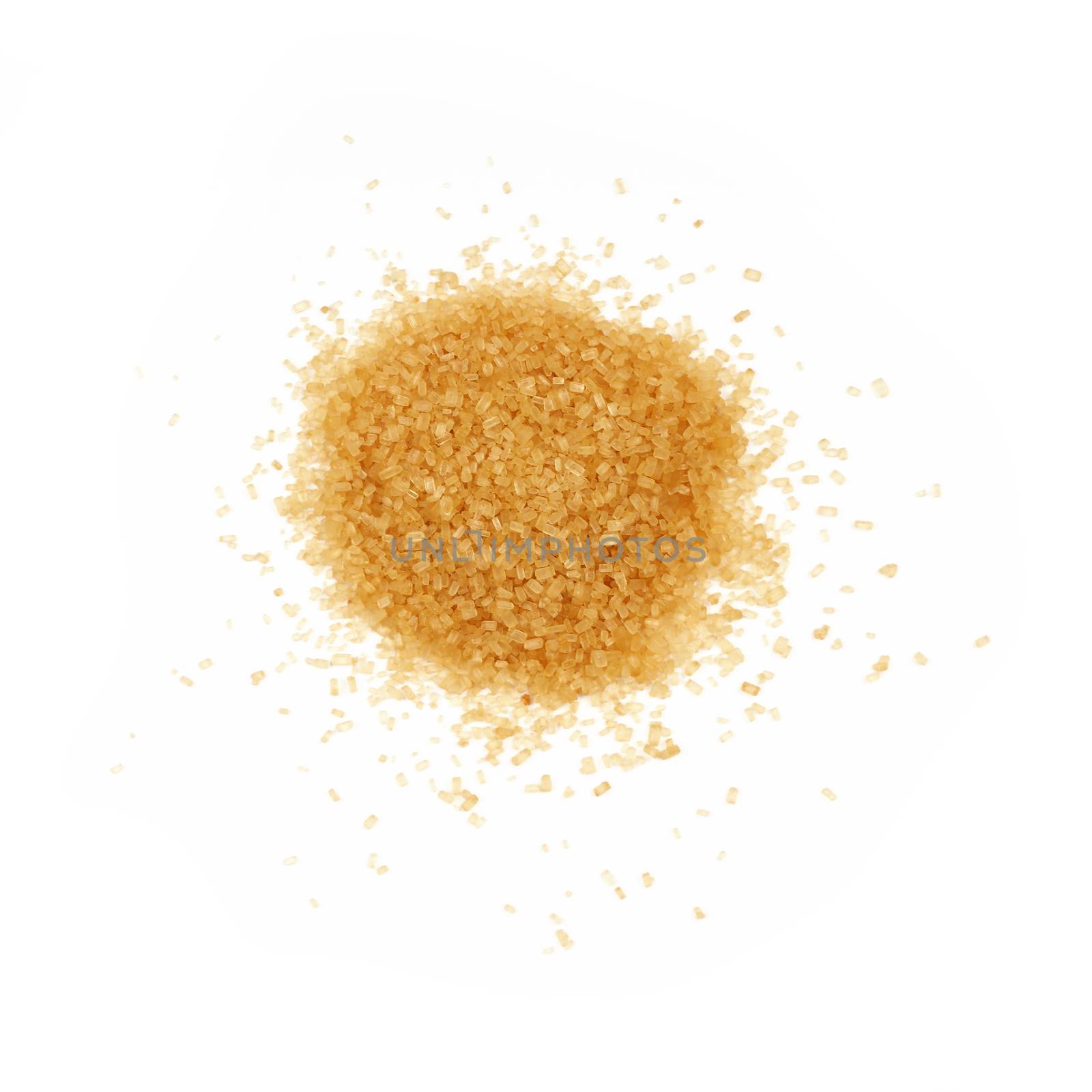Pinch of brown cane sugar spilled around isolated on white background, close up, elevated top view