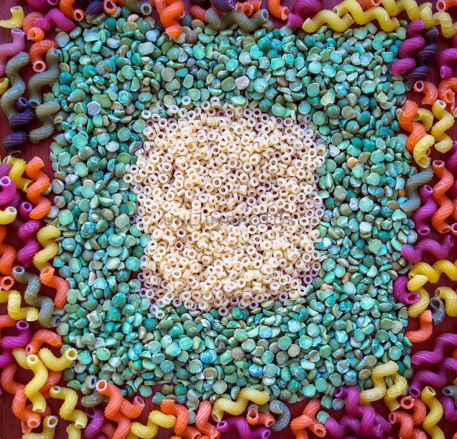 the pasta plus peas all colors of the rainbow on the table by Oleczka11