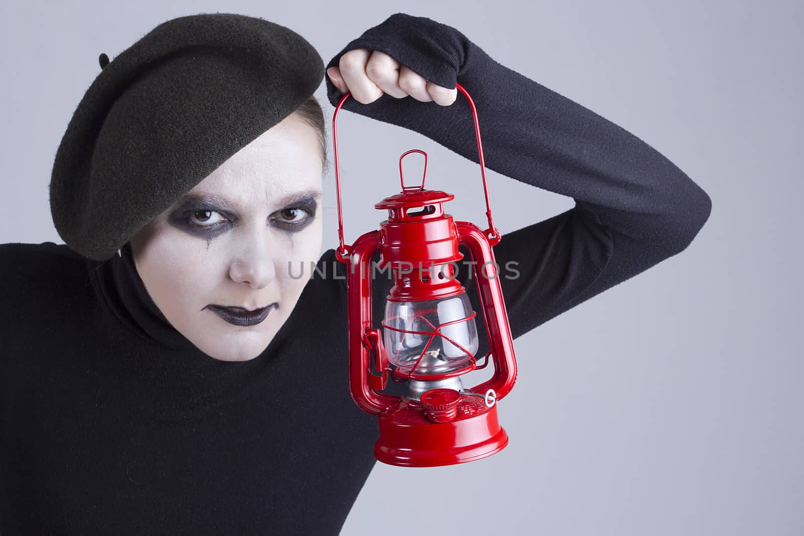 Young woman mime with red lantern