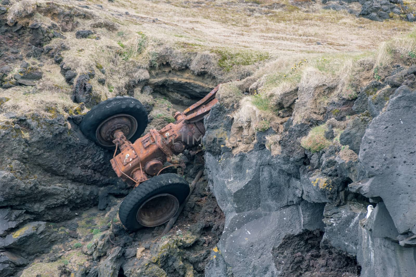 Tractor wreck by a cliff edge
