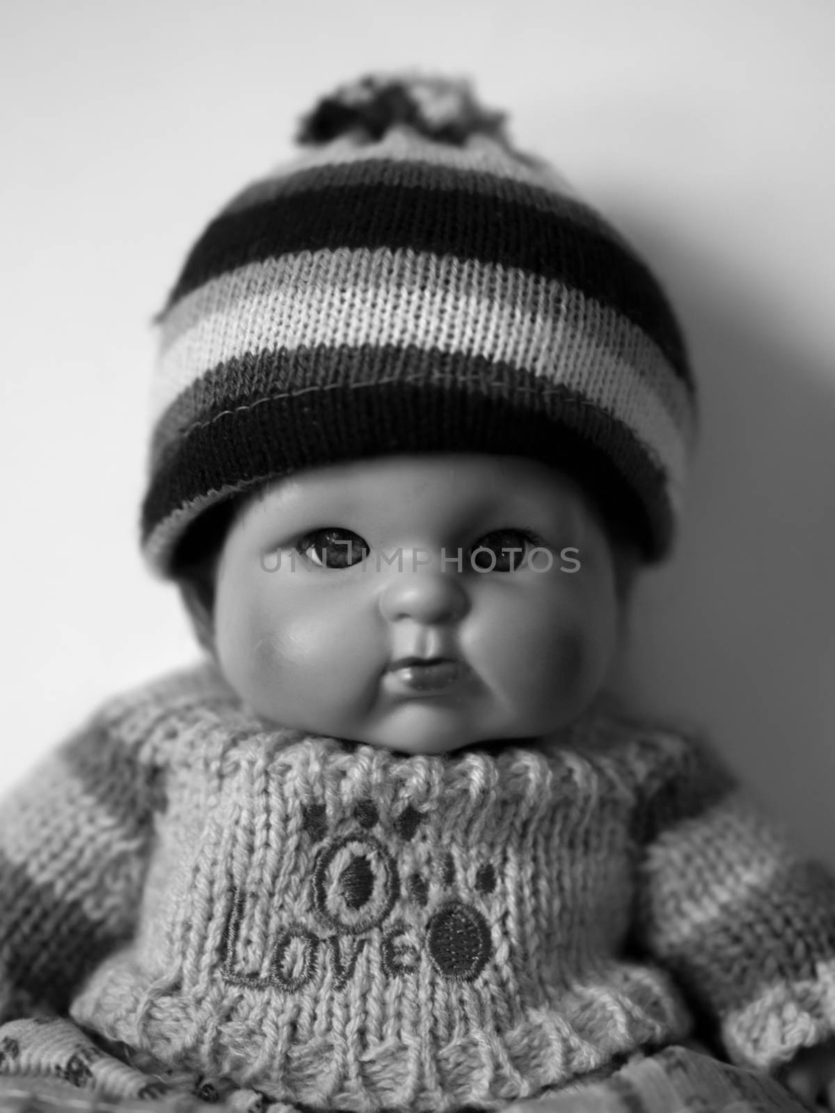 BLACK AND WHITE PHOTO OF PORTRAIT OF A DOLL