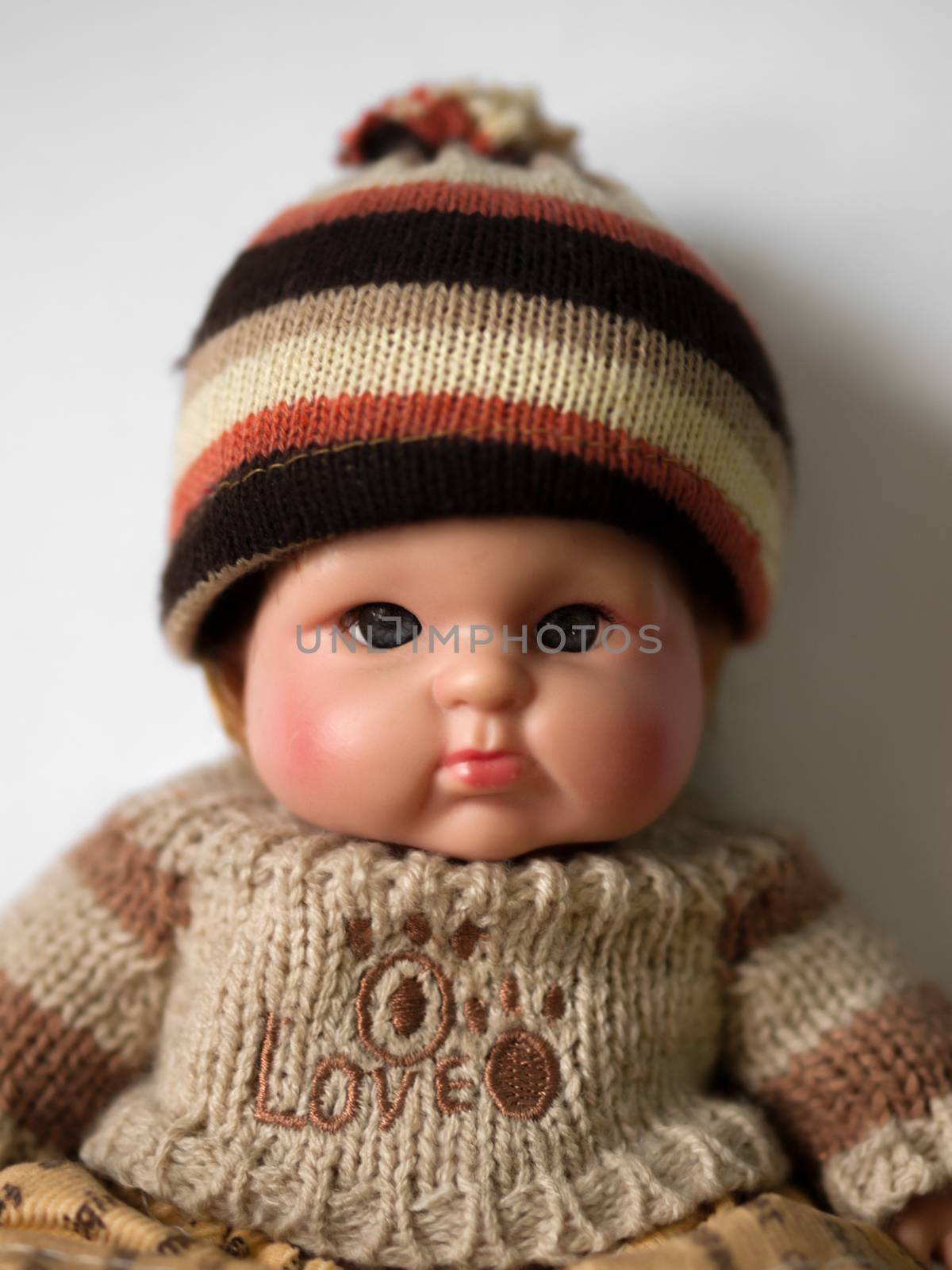 COLOR PHOTO OF PORTRAIT OF A DOLL
