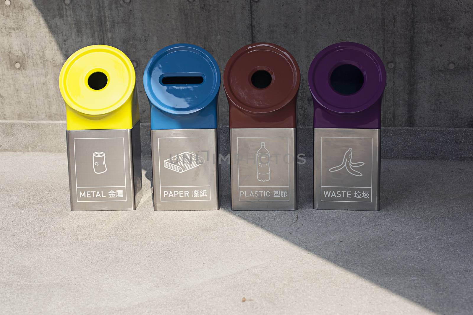 Modern bins for different types of garbage. Metal paper plastic and waste