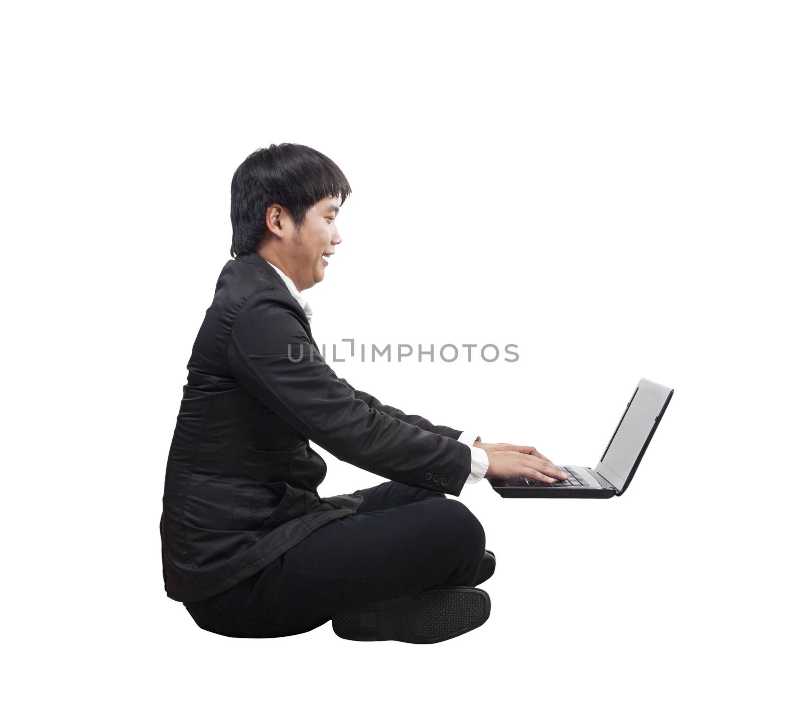 young business man working on computer laptop with happy and funny face isolated white background