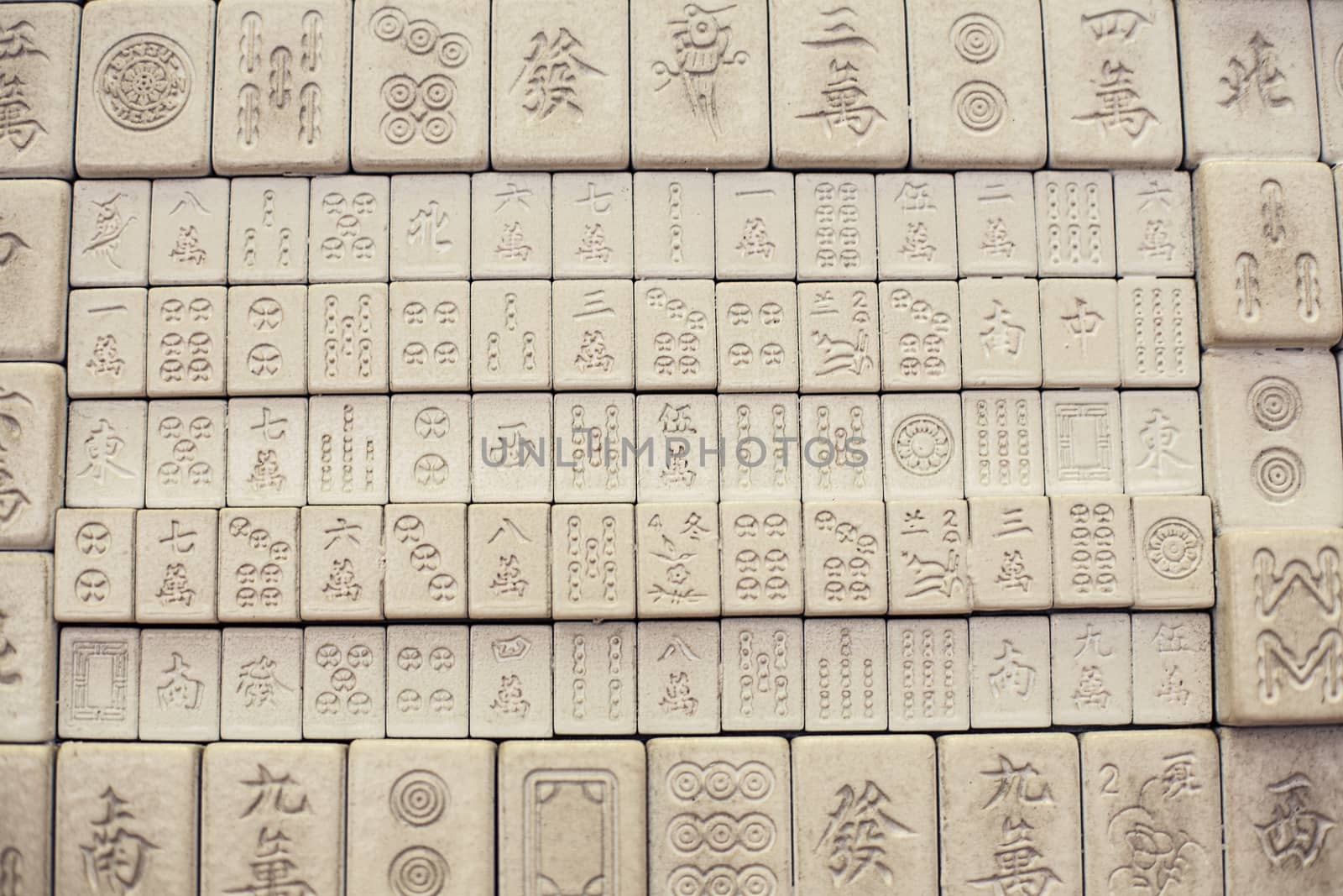 Wall of chinese characters on bricks. White background