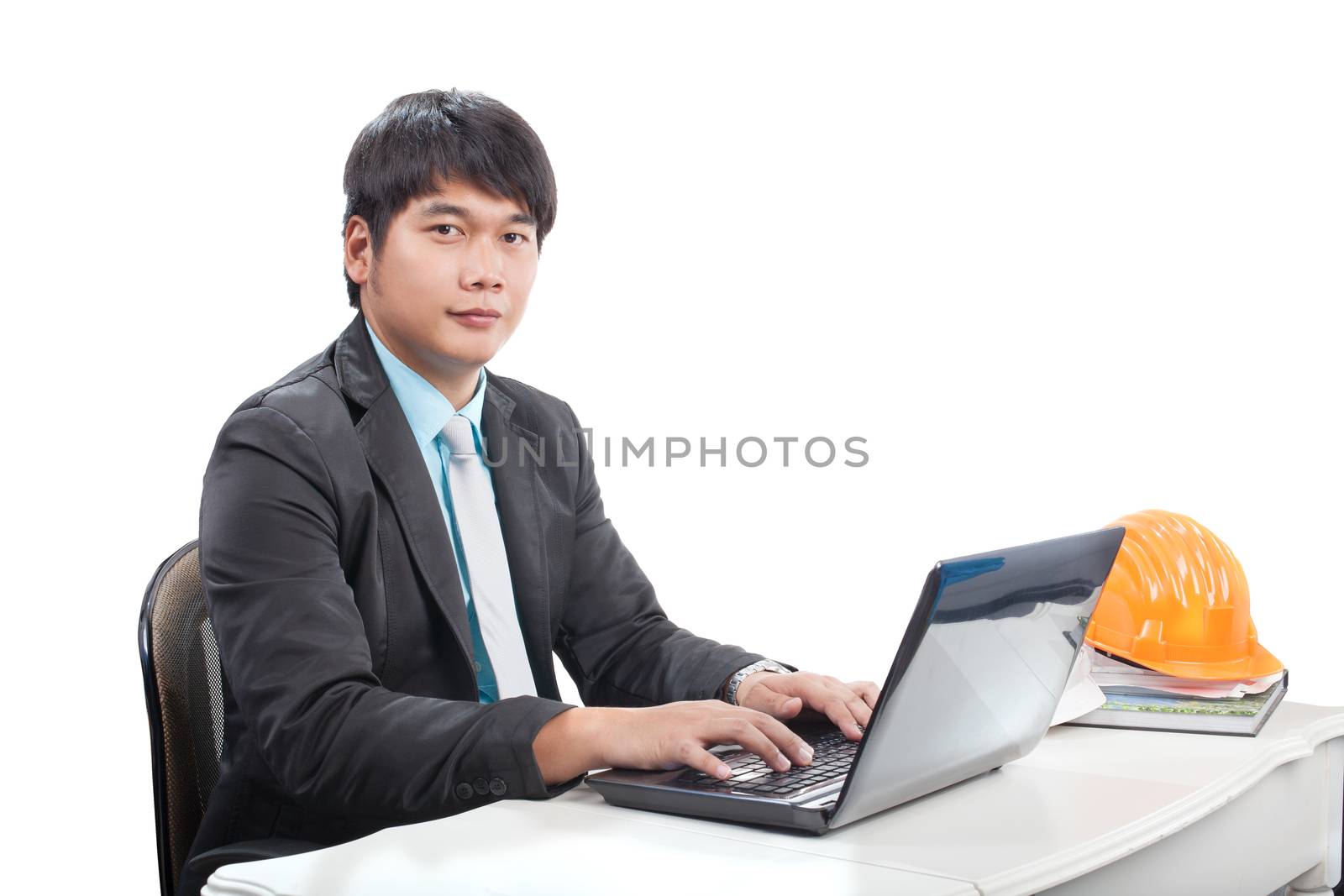 portrait young engineering  man sittin and working on laptop com by khunaspix