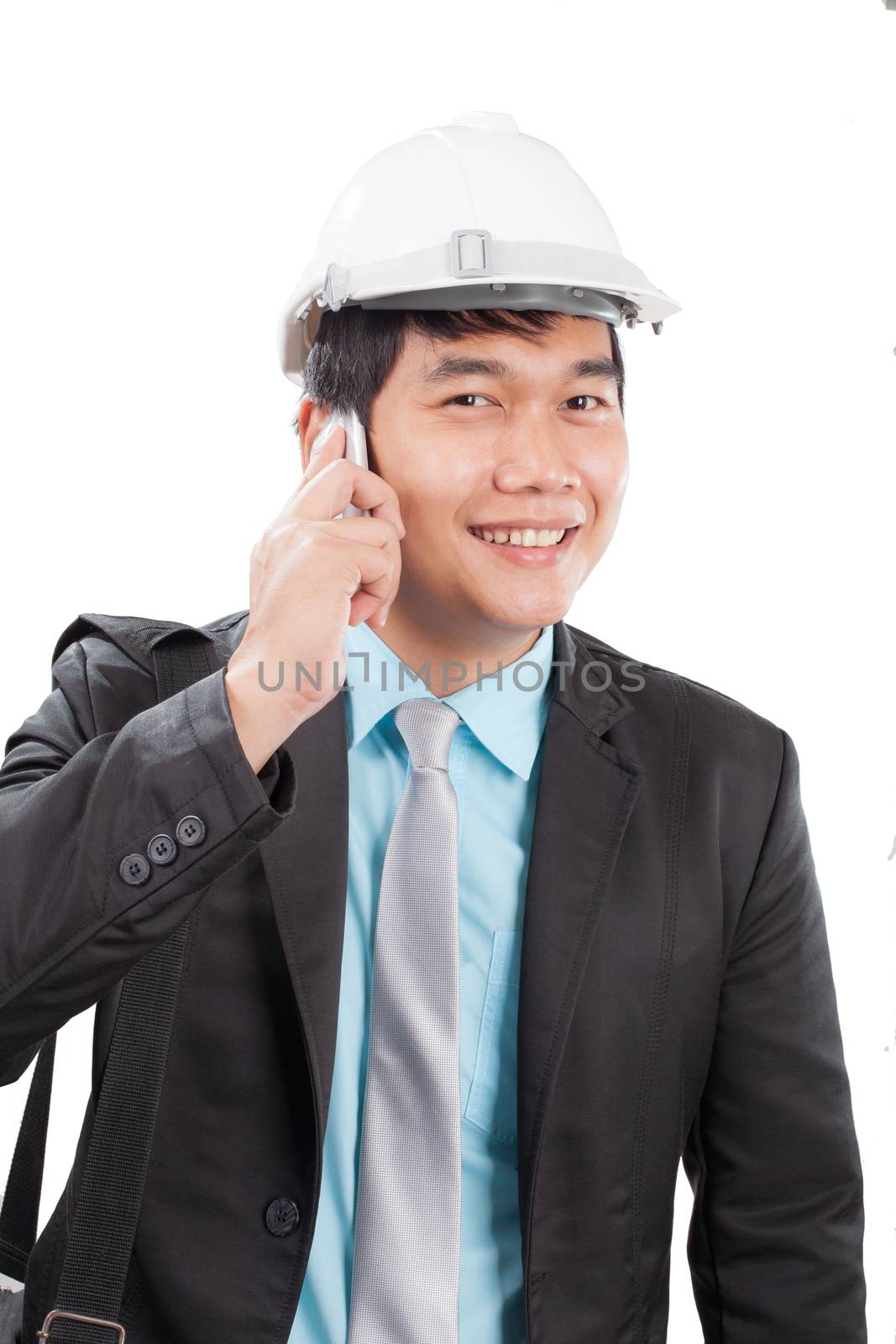 engineer man talkin on mobile phone and smiling with happy emoti by khunaspix