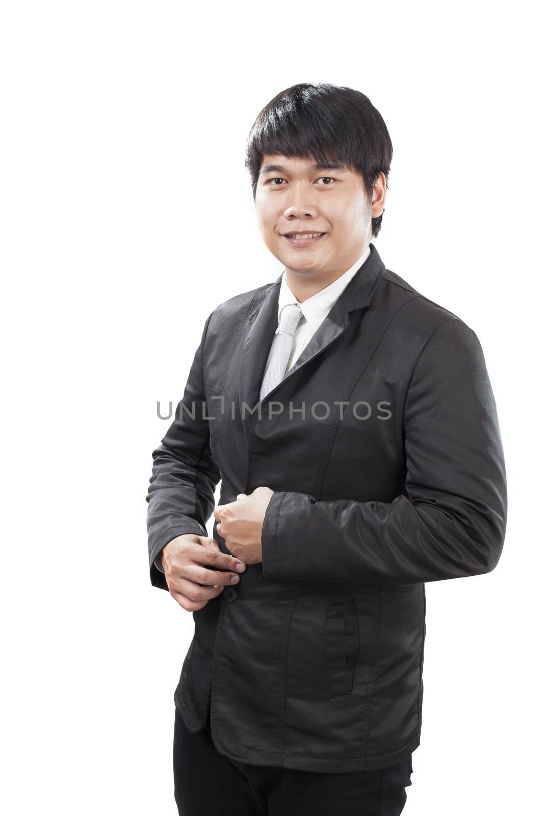 young business man with western suit standing in front of white  by khunaspix