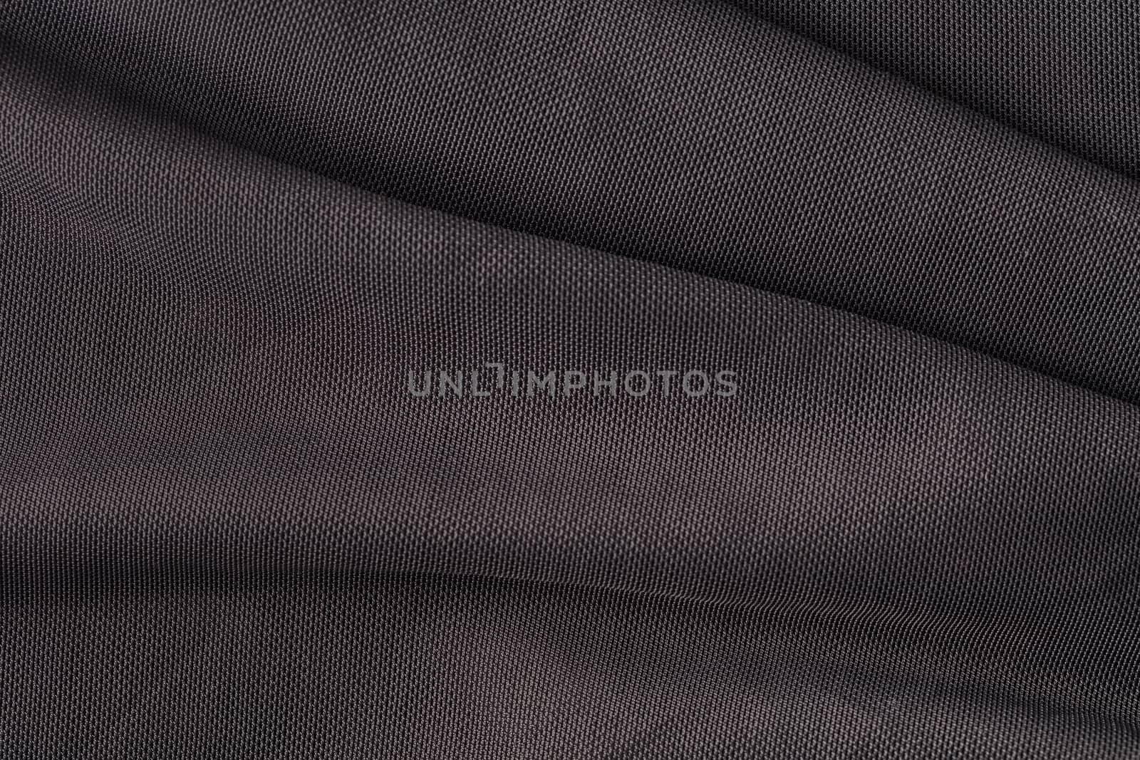 the abstract background texture of synthetic fabric