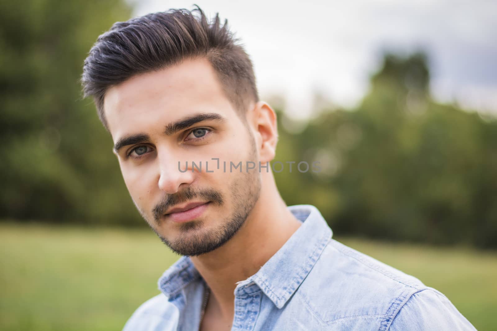 Handsome young man at countryside by artofphoto