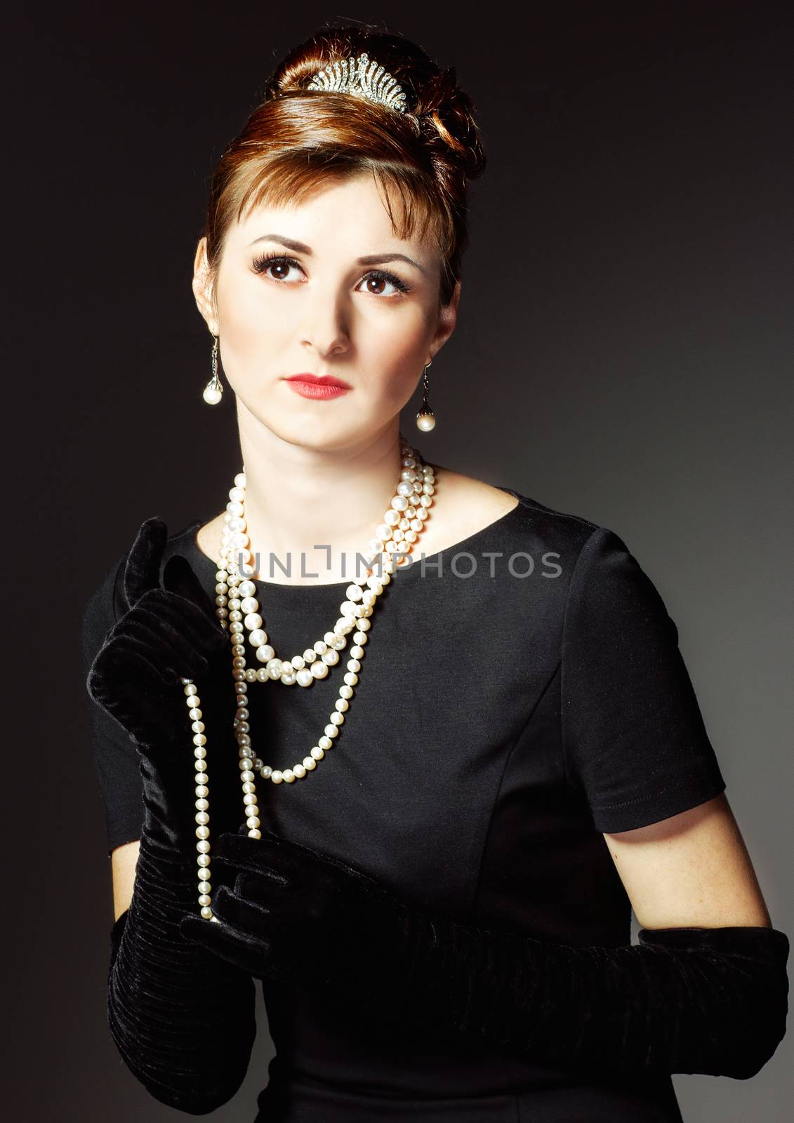 vintage Portrait of a beautiful young elegant woman. The girl in the image of Audrey Hepburn.