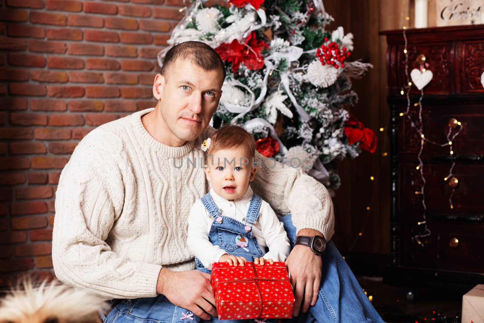 happy father and his adorable little daughter among Christmas de by natazhekova
