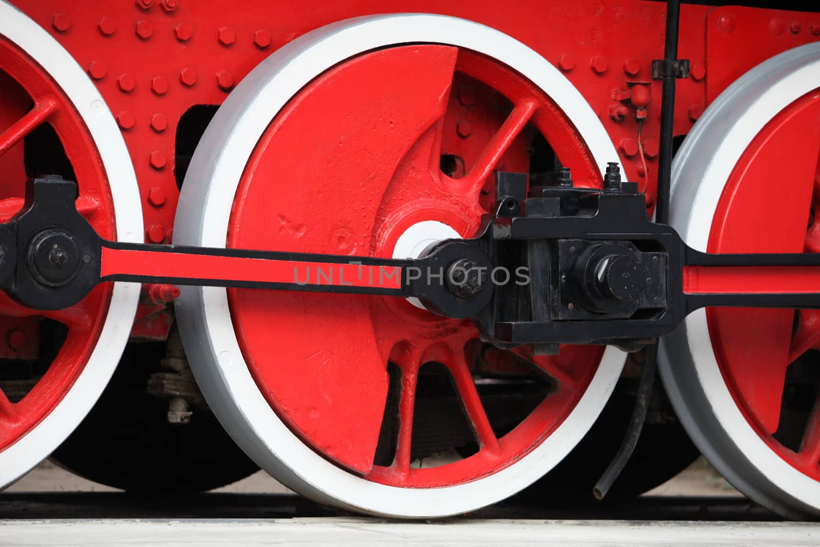 red wheel of an old steam locomotive