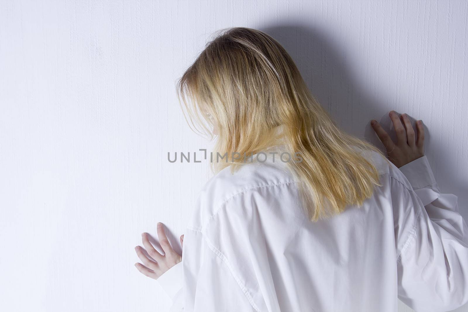 Young woman with depression isolated on white background