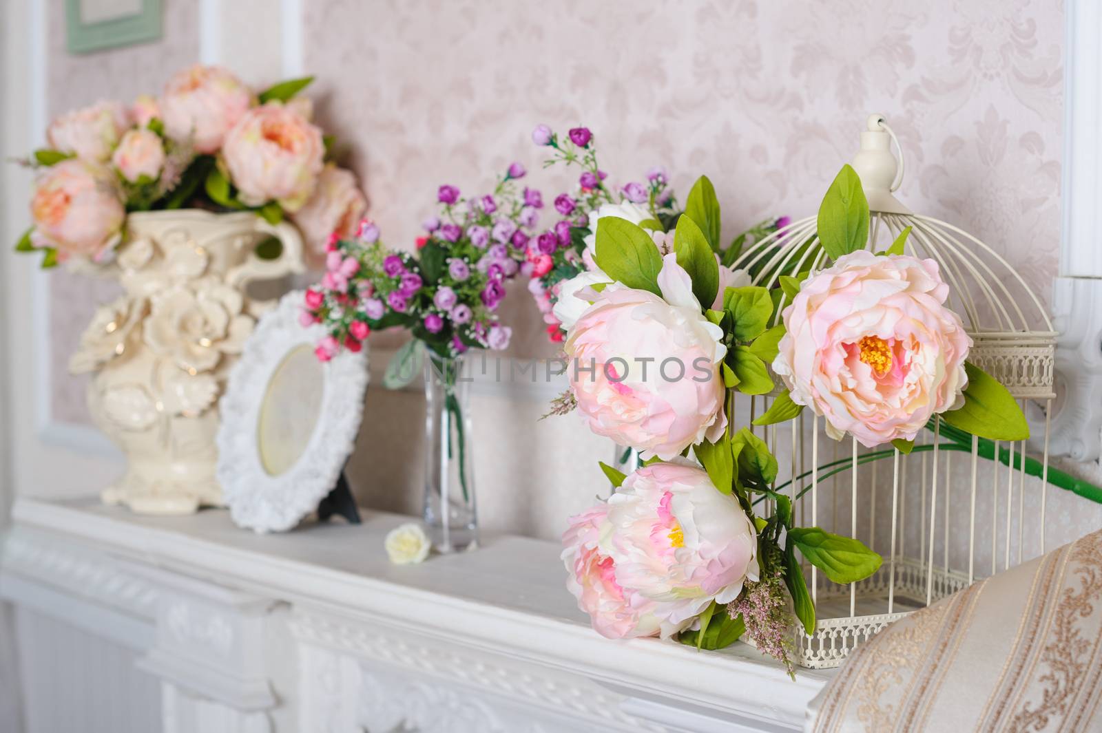 decorations with flowers on the shelf in the interior in the living room.