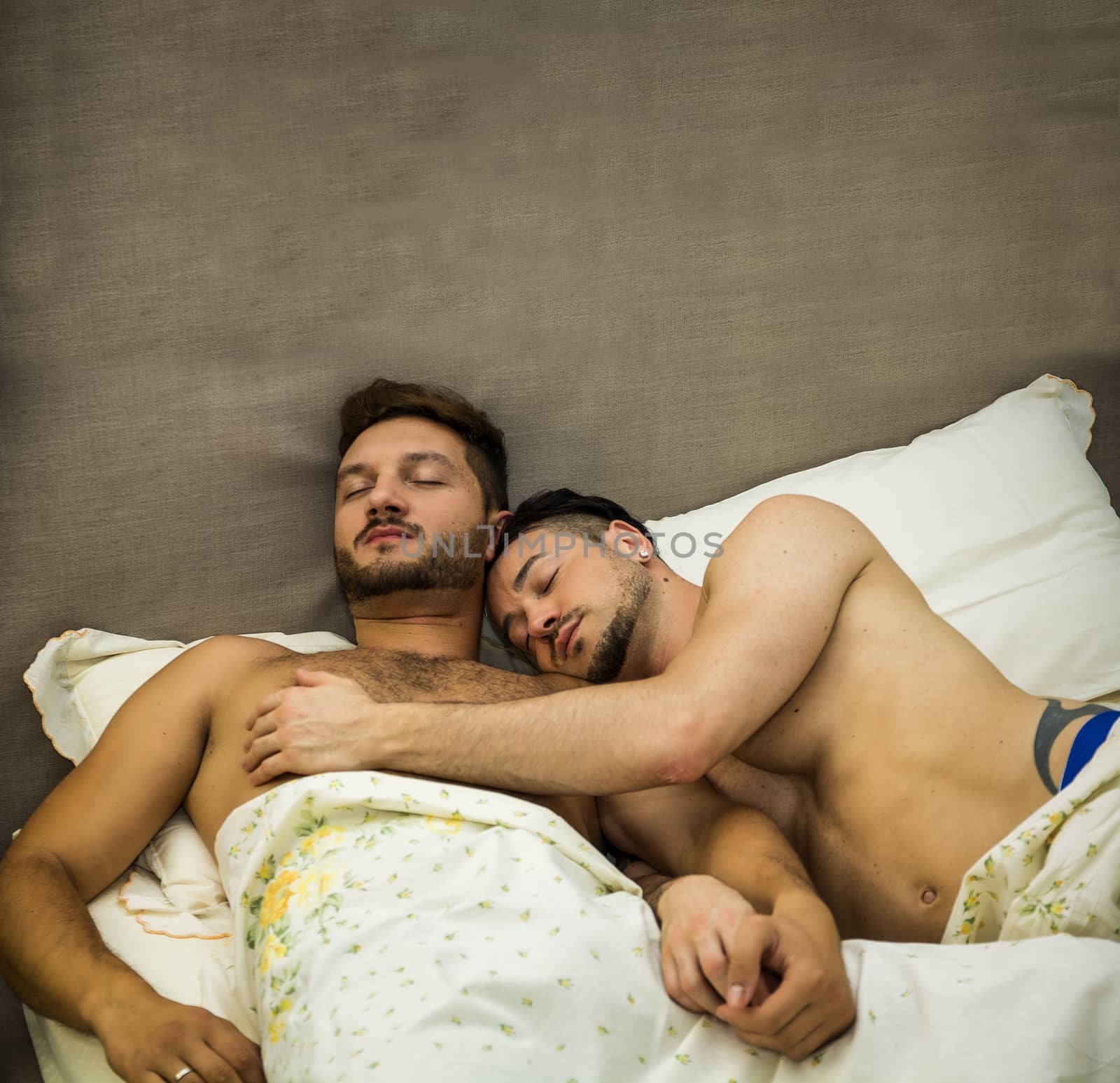 Gay couple in bed sleeping by artofphoto