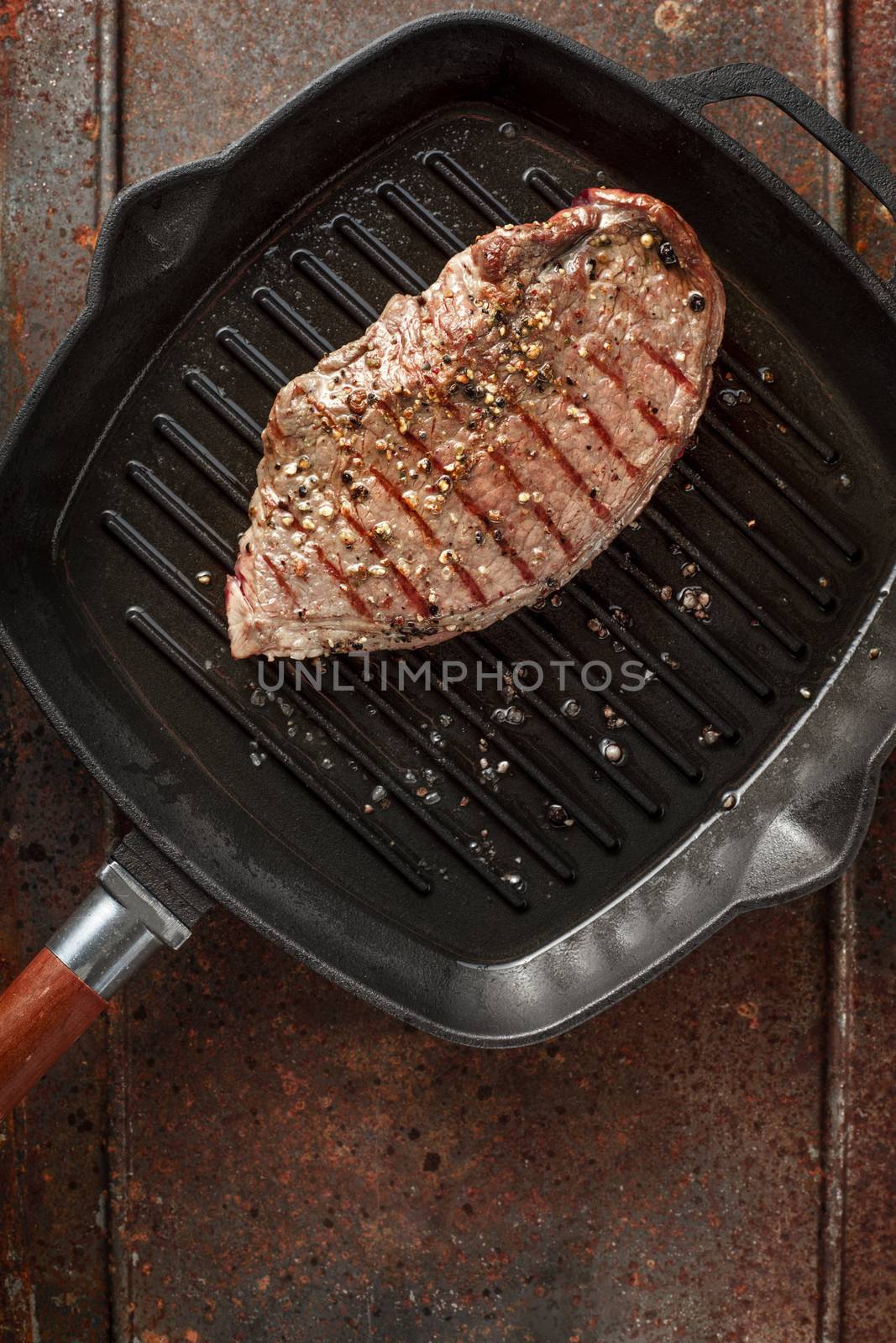 Roast beef steak on pan grill vertical