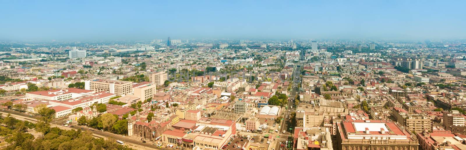 Aerial panorama of Mexico City on a sunny morning. Mexico City is a capitol on Mexico. The camera is pointed to East.