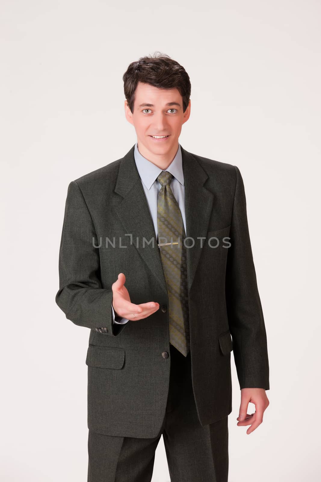 Young businessman in a suit on isolated background