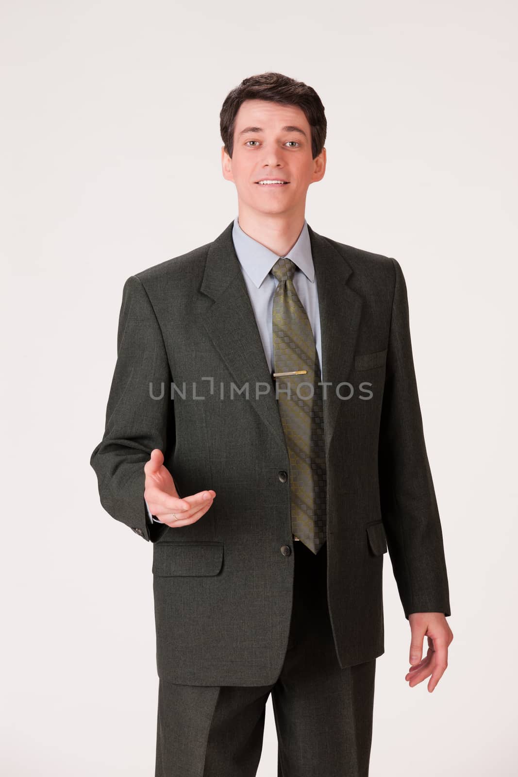 Young businessman in a suit on isolated background