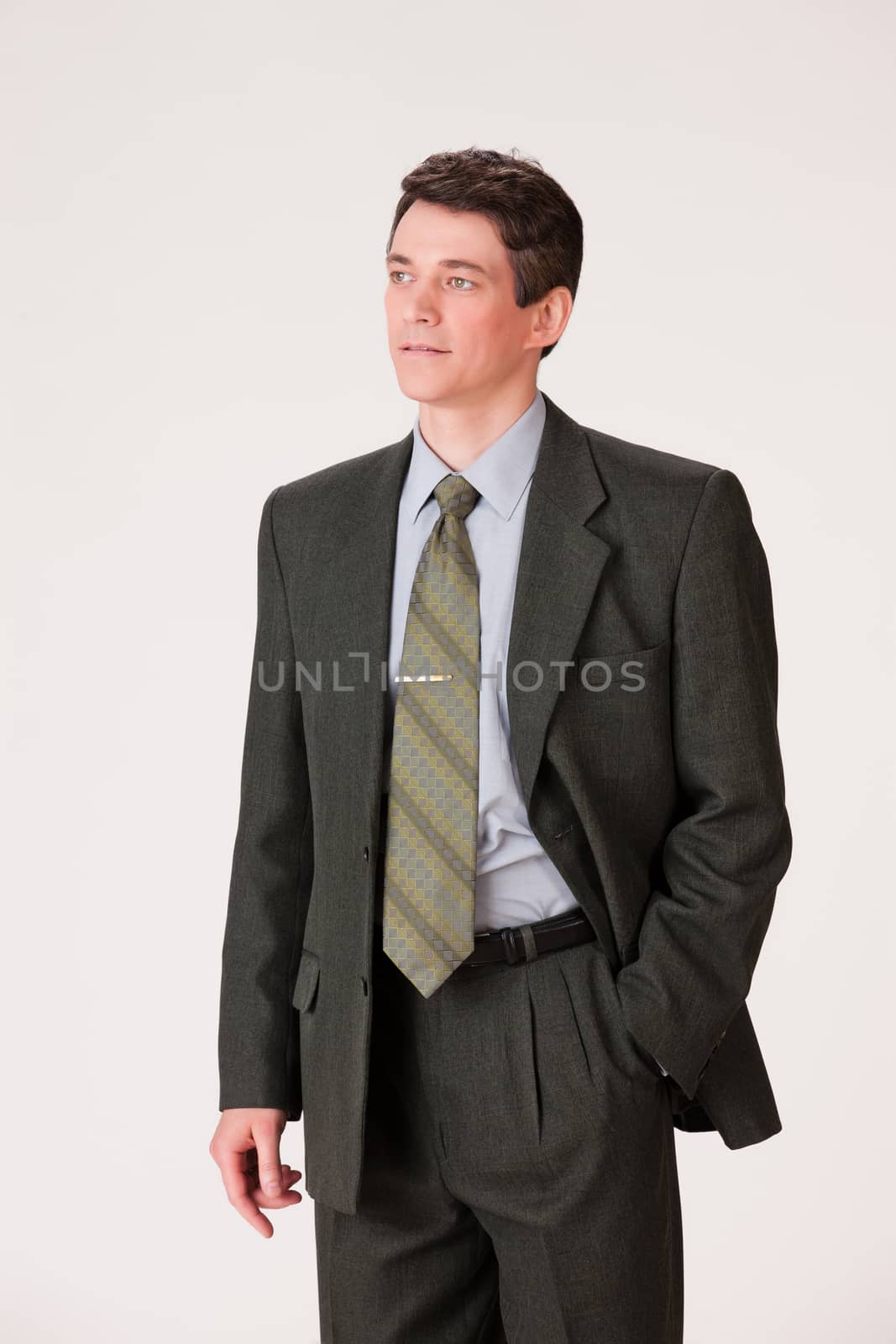 Young businessman in a suit on isolated background