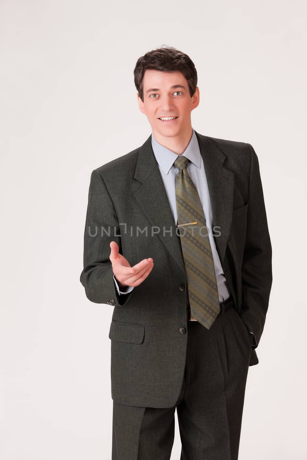 Young businessman in a suit on isolated background