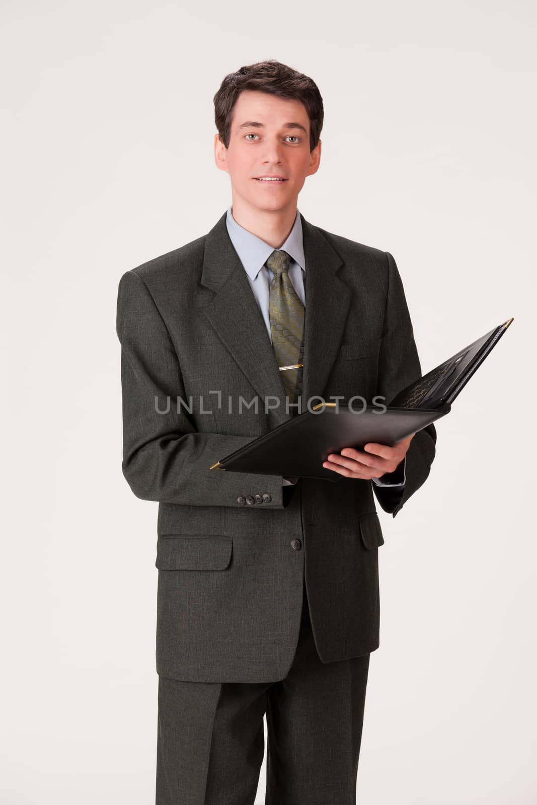 Young businessman in a suit on isolated background