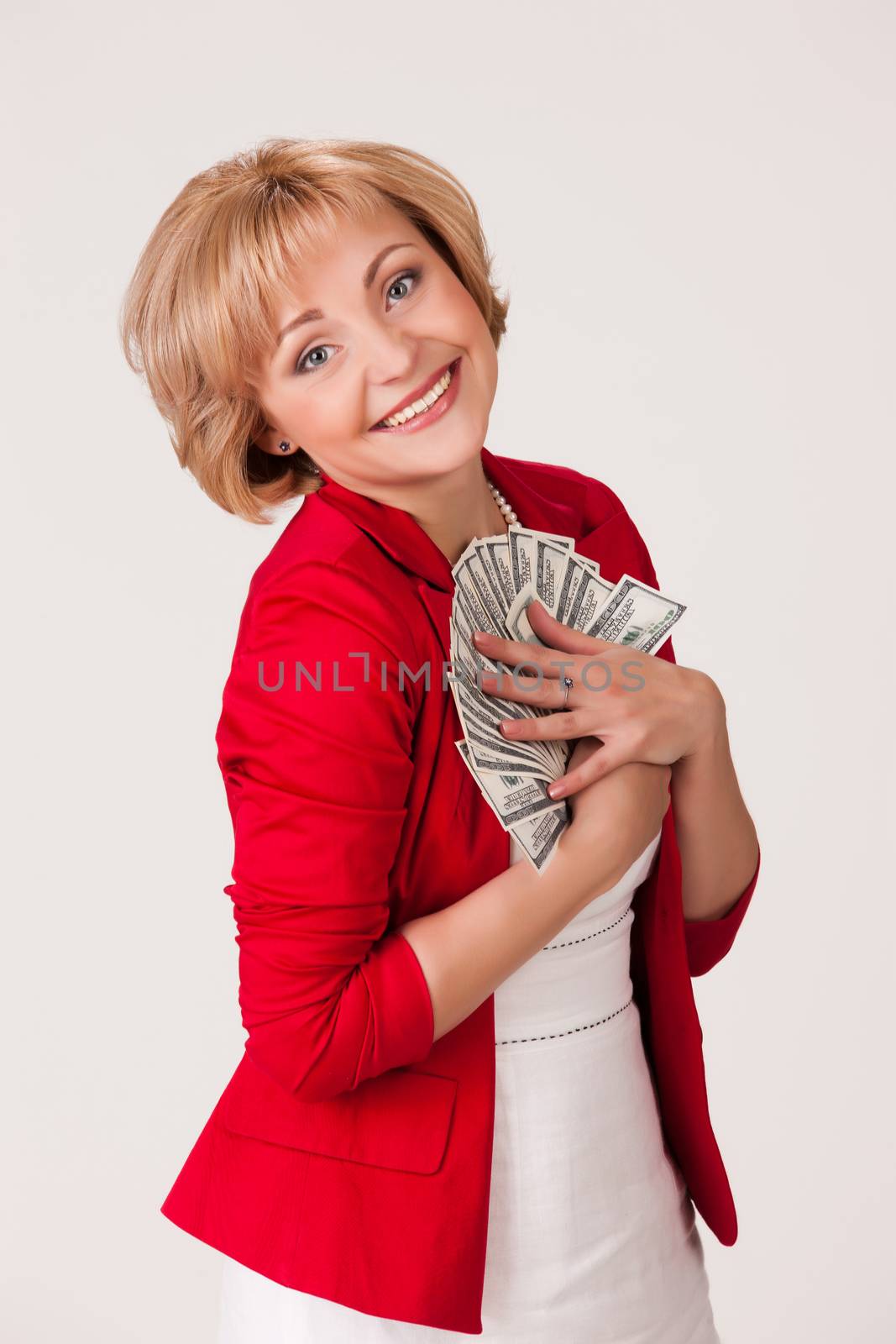 Young woman with a bunch of dollar banknotes