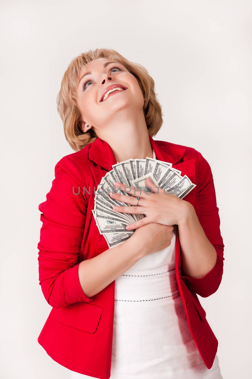 Young woman with a bunch of dollar banknotes