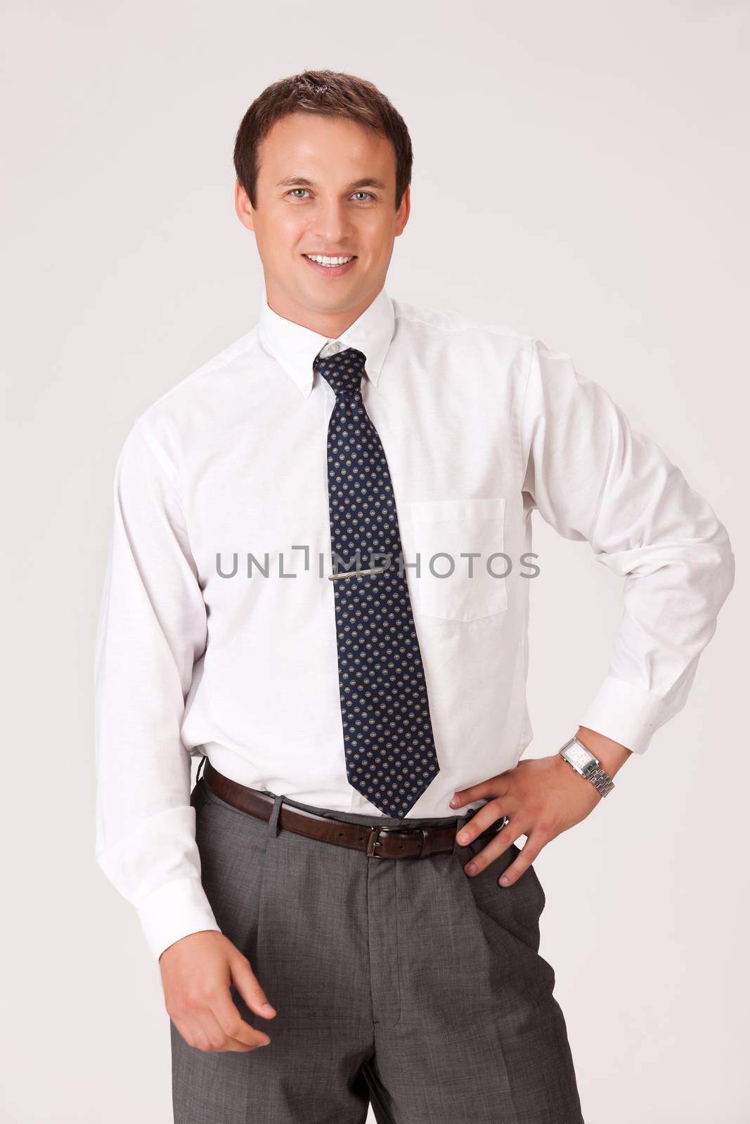 Young businessman in a suit on isolated background