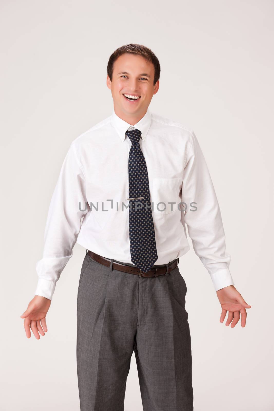Young businessman in a suit on isolated background