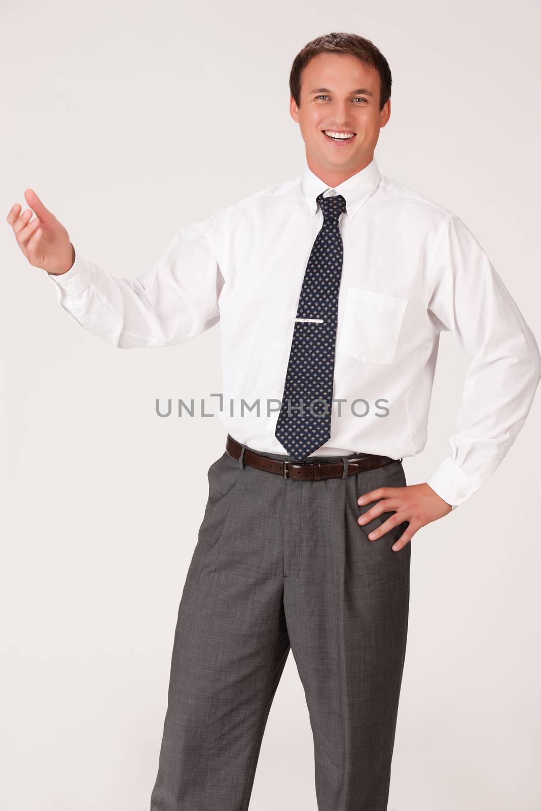 Young businessman in a suit on isolated background