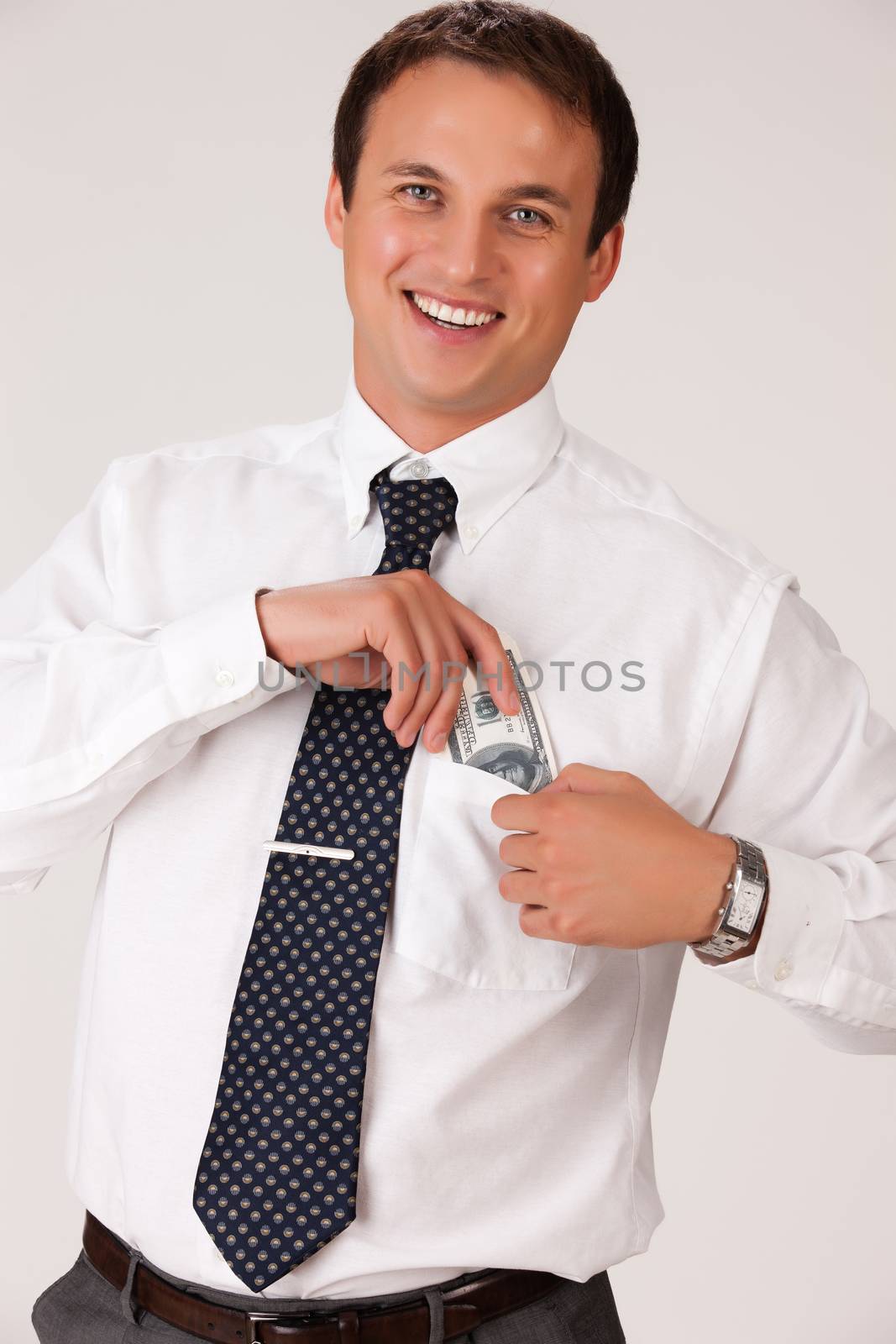 Young man with dollar banknotes on isolated background