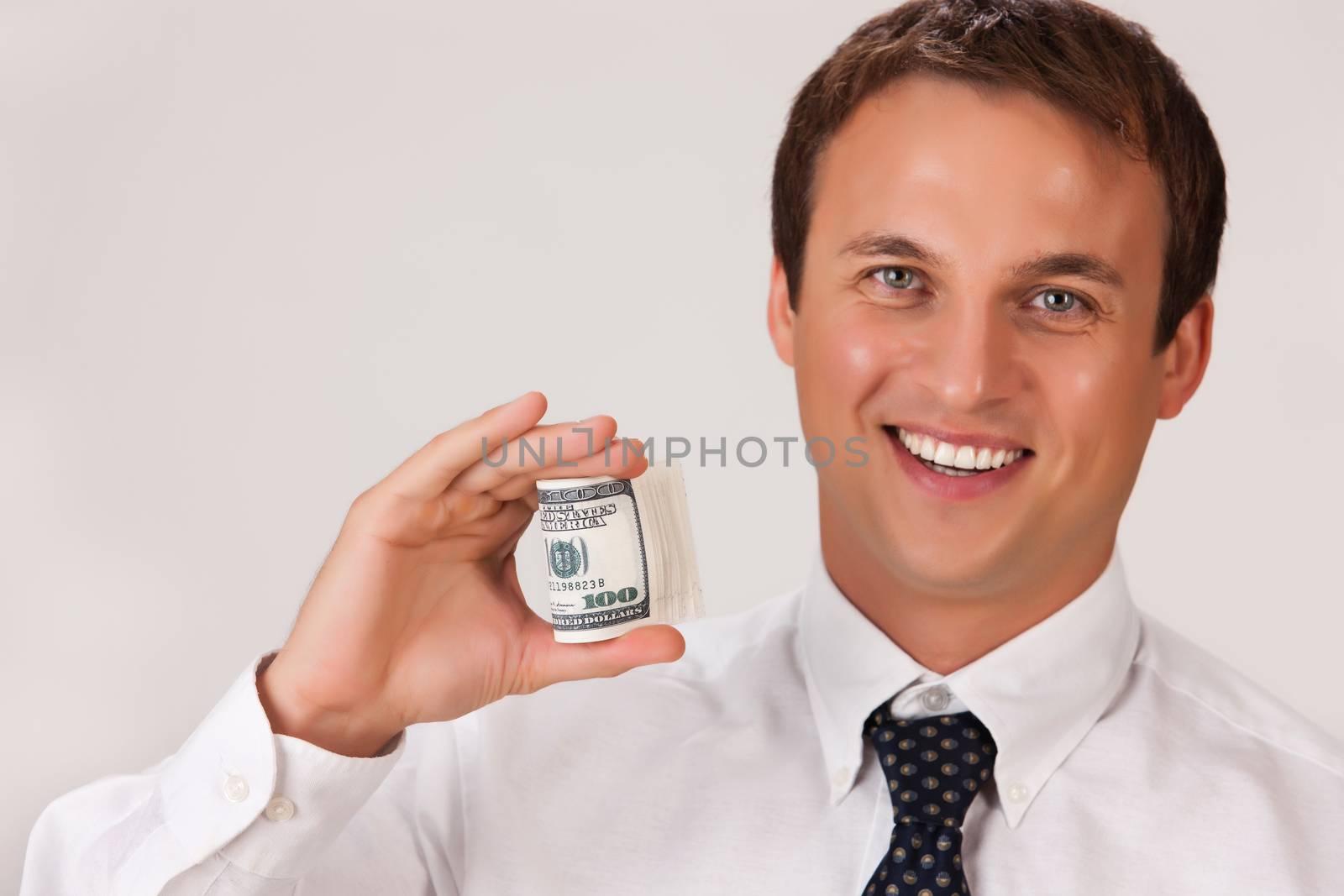 Young businessman in a suit on isolated background