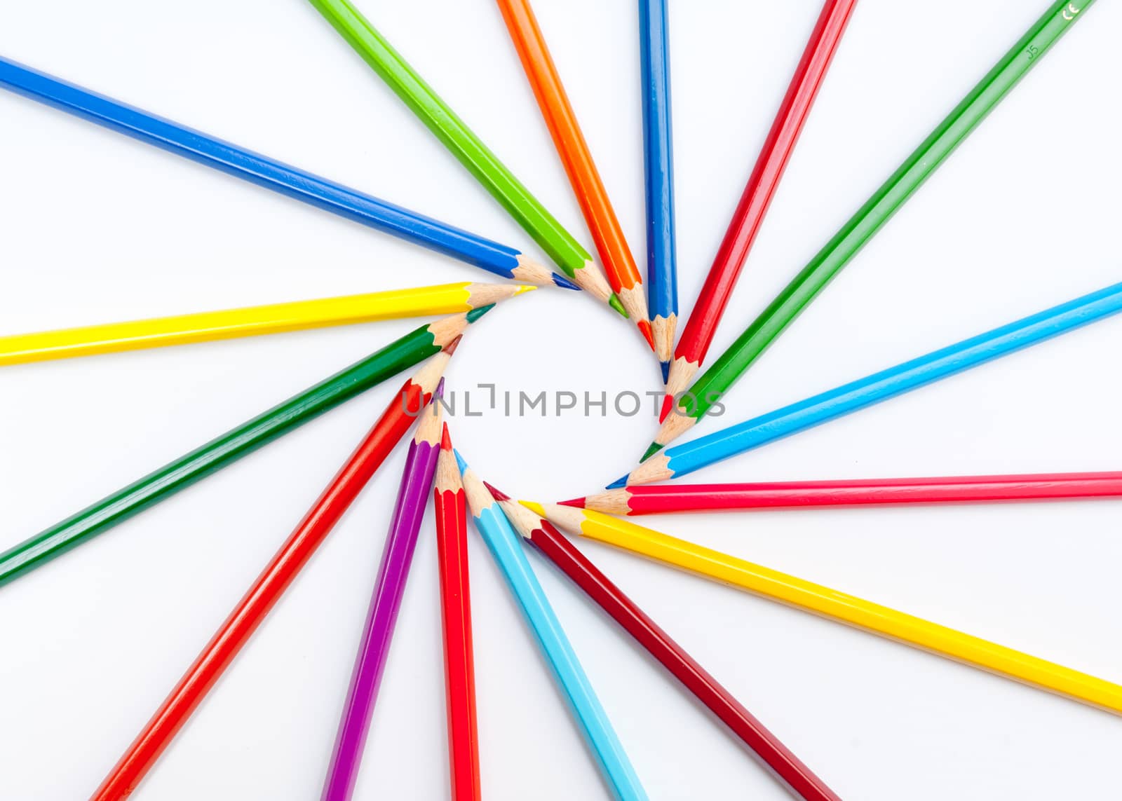 Pattern of color pencils isolated on white background close up