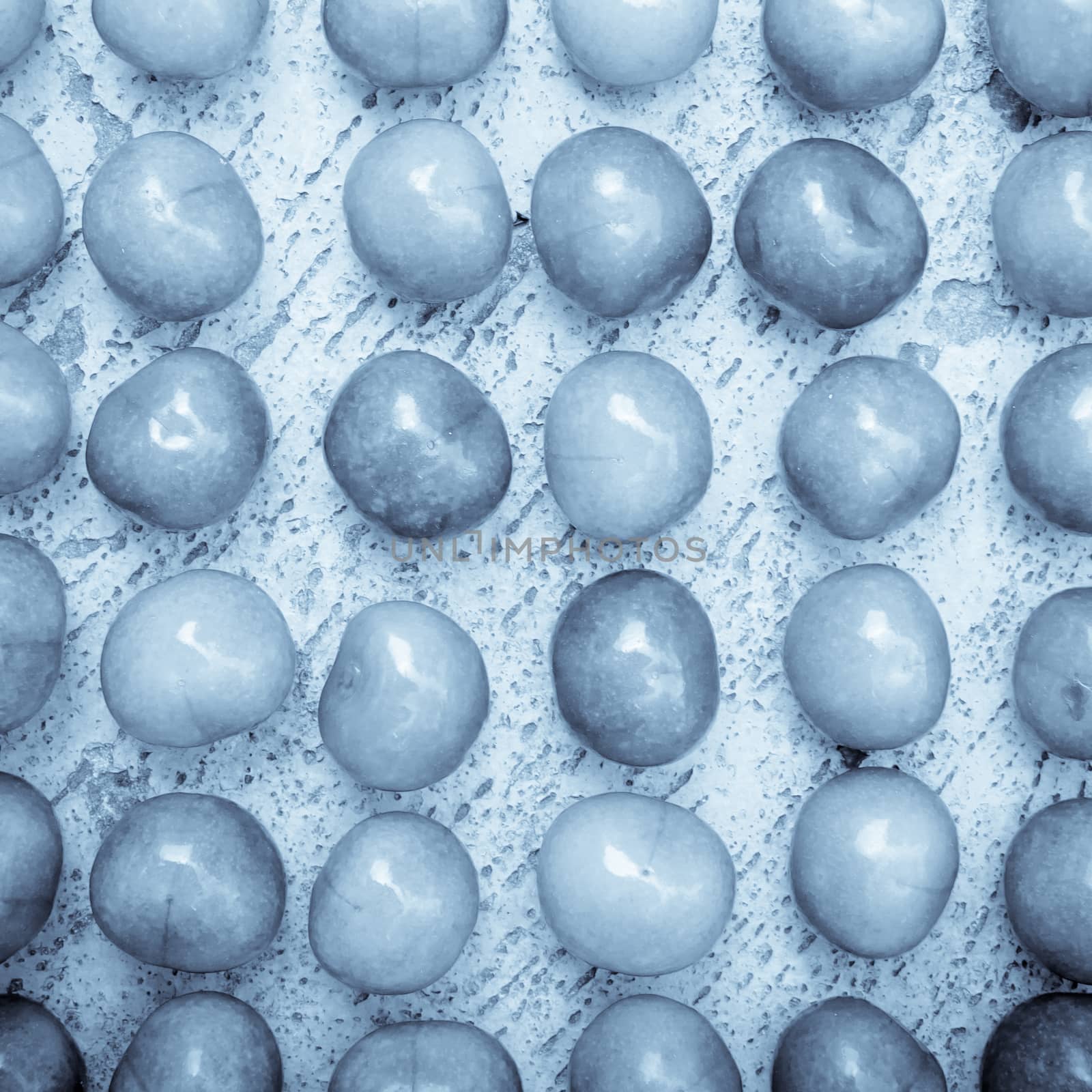 Arrangement of ripe cherries on blue textrured background, cherry pattern