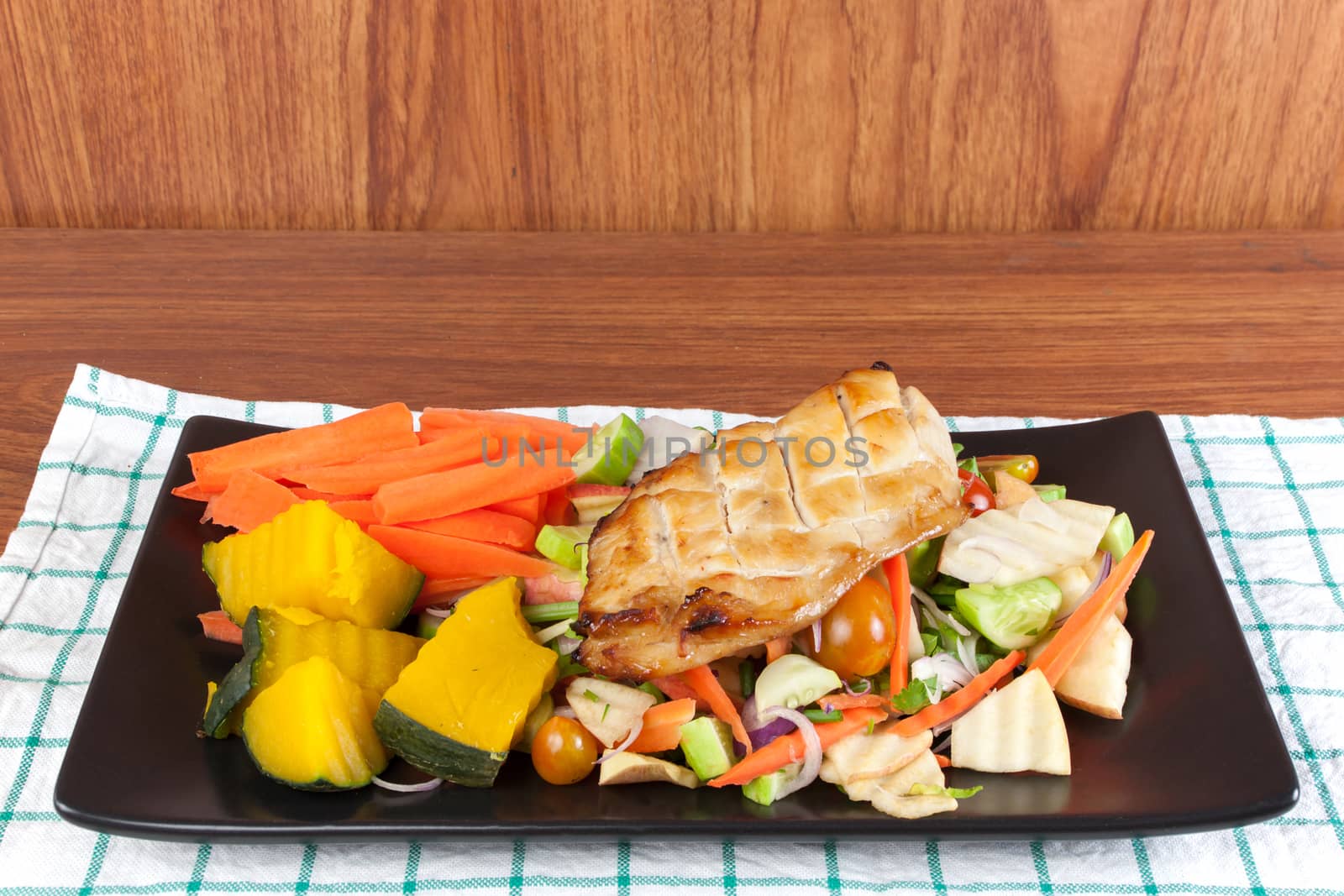 Grilled chicken steak with spices and vegetable on the black dish, Healthy diet meals.