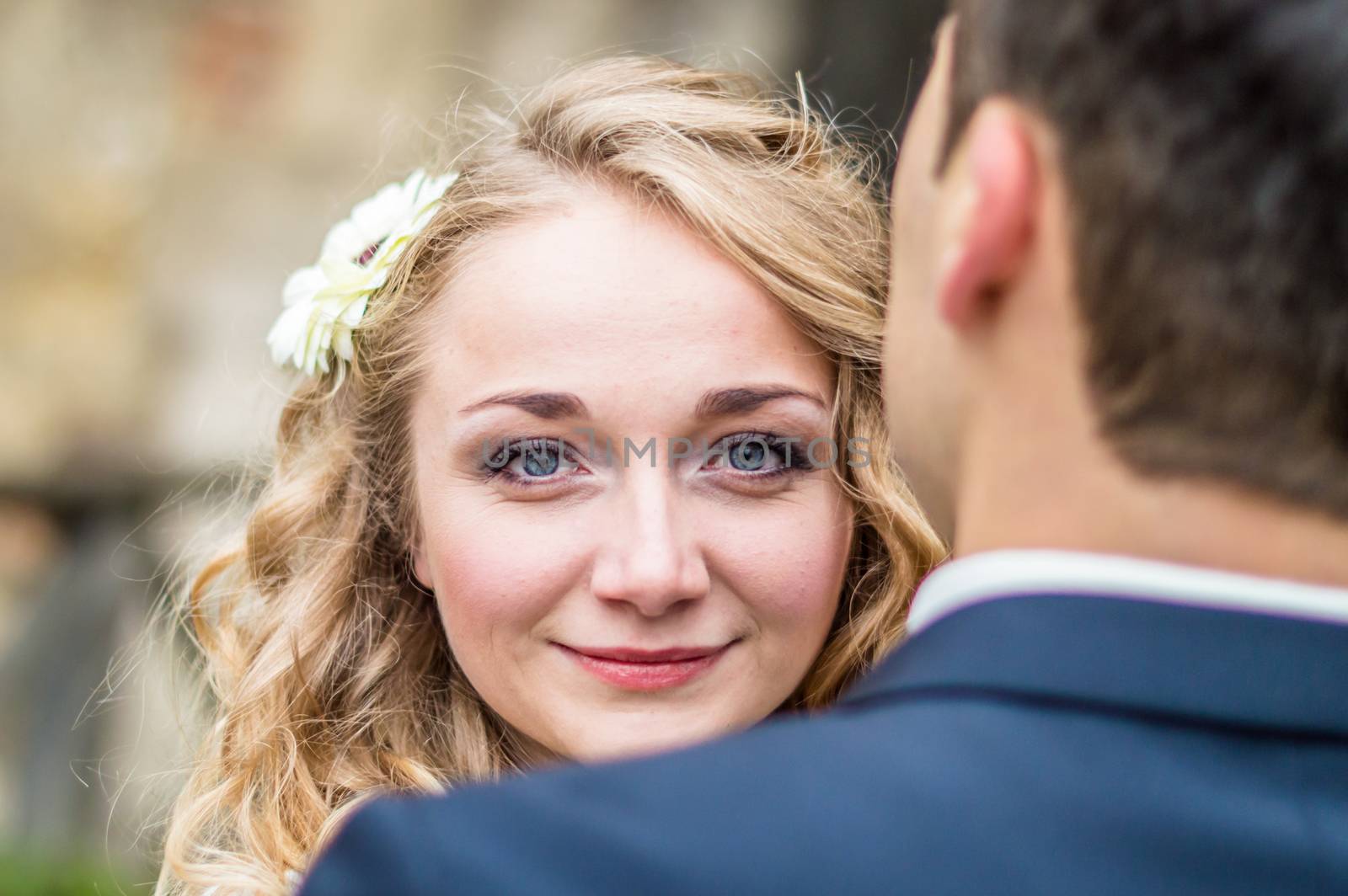 Portrait of a bride from the groom in the city