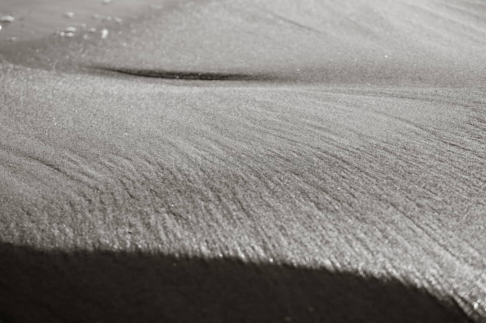 Closeup look of sand waves on Baltic beach, bw