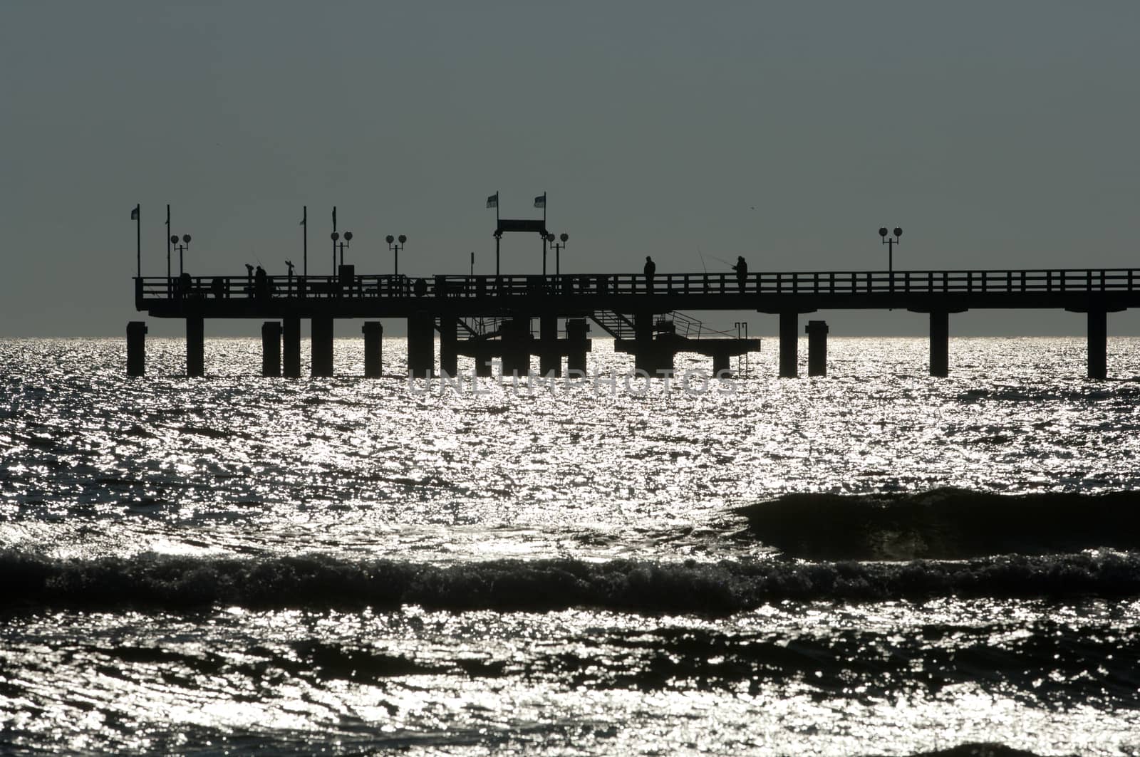 Wooden pier in Baltic see in backlight by horizonphoto