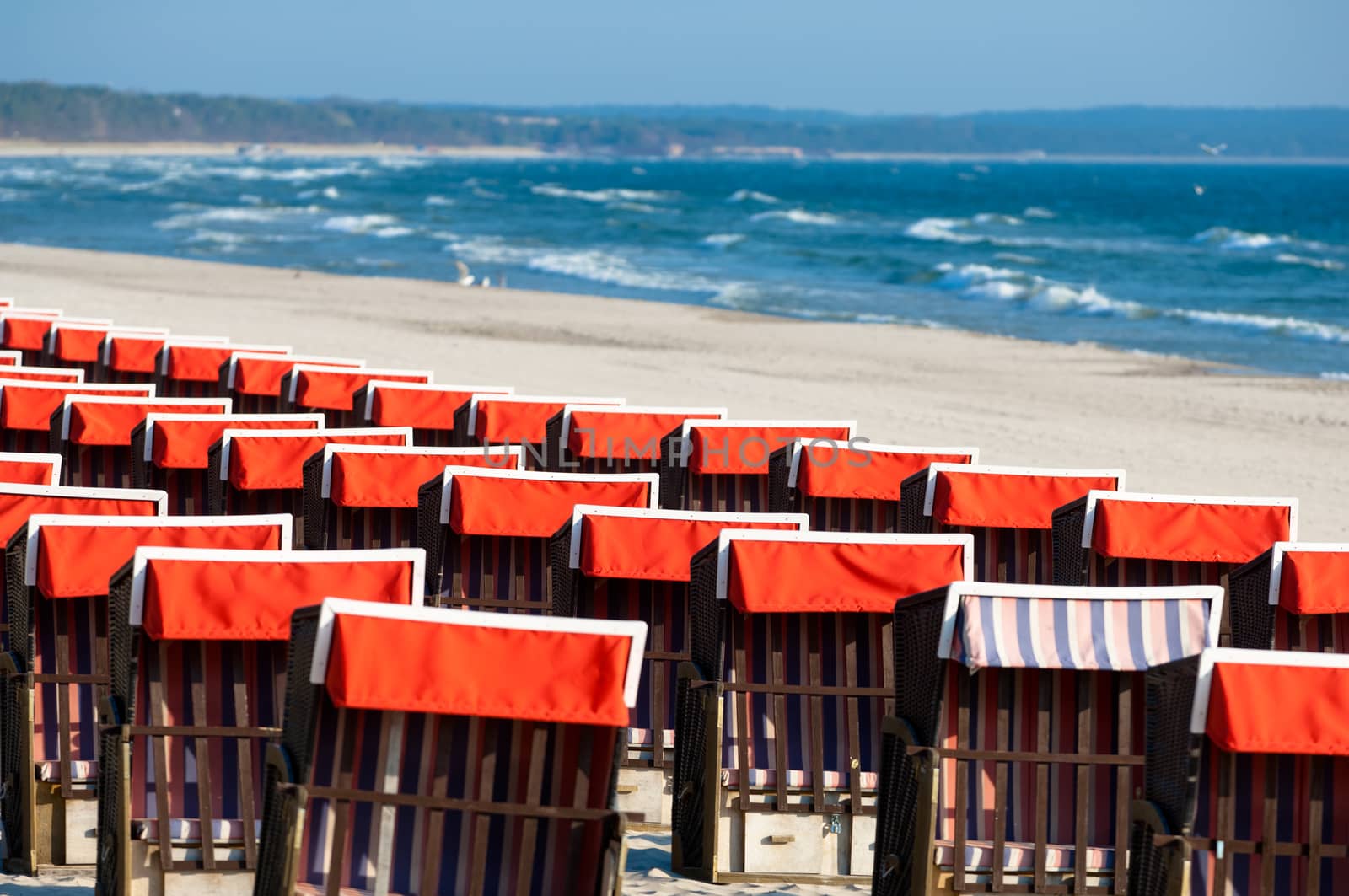 Strandkorb, Strandkoerbe in Rugen, Germany, Beach chairs on the sandy beach in Binz