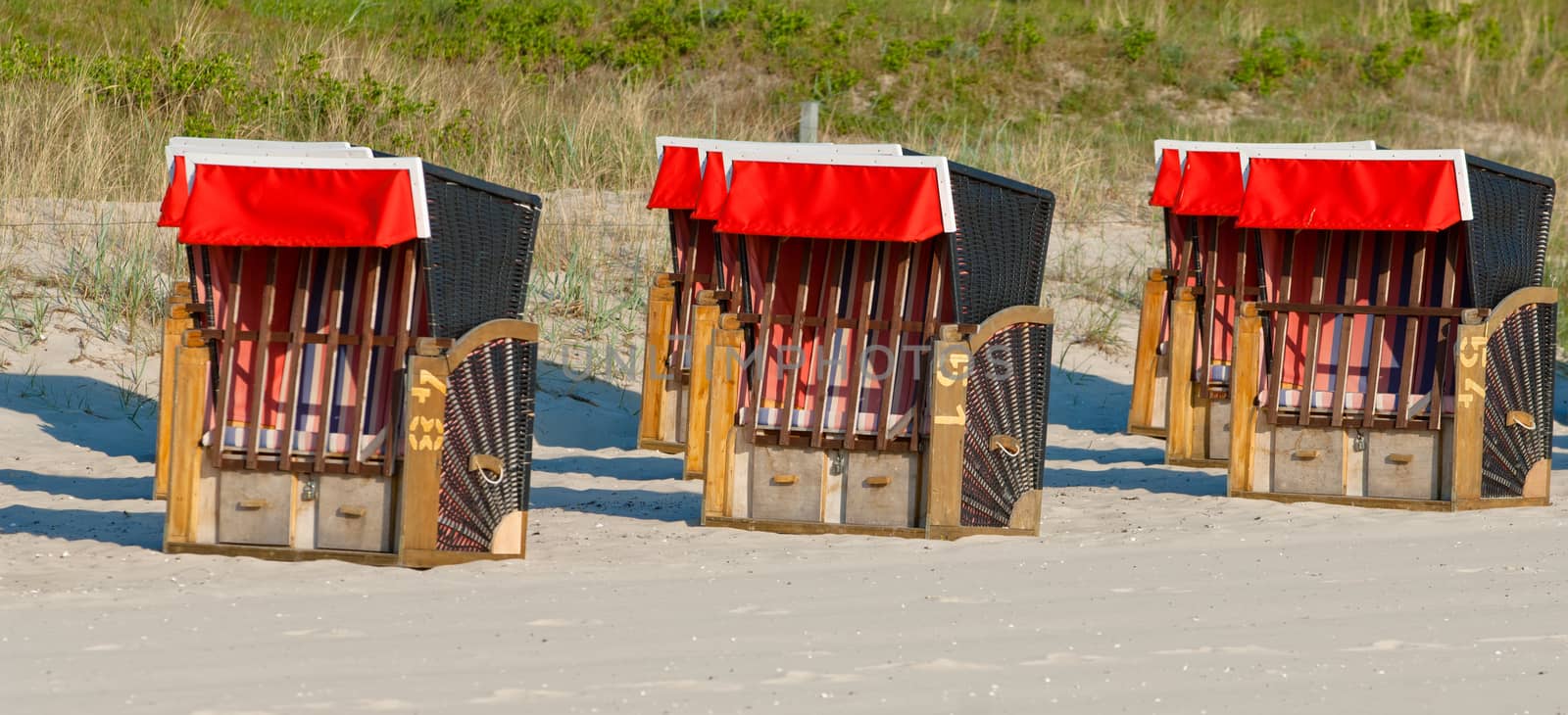 Strandkorb, Strandkoerbe in Rugen, Germany, Beach chairs on the sandy beach in Binz