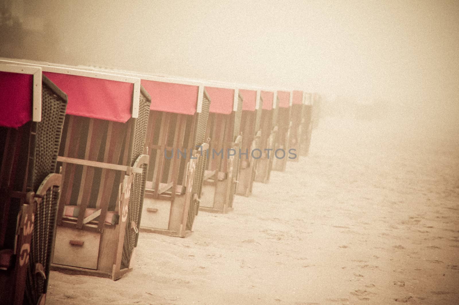 Strandkorb, Strandkoerbe in Rugen, Germany, Beach chairs on the sandy beach in Binz