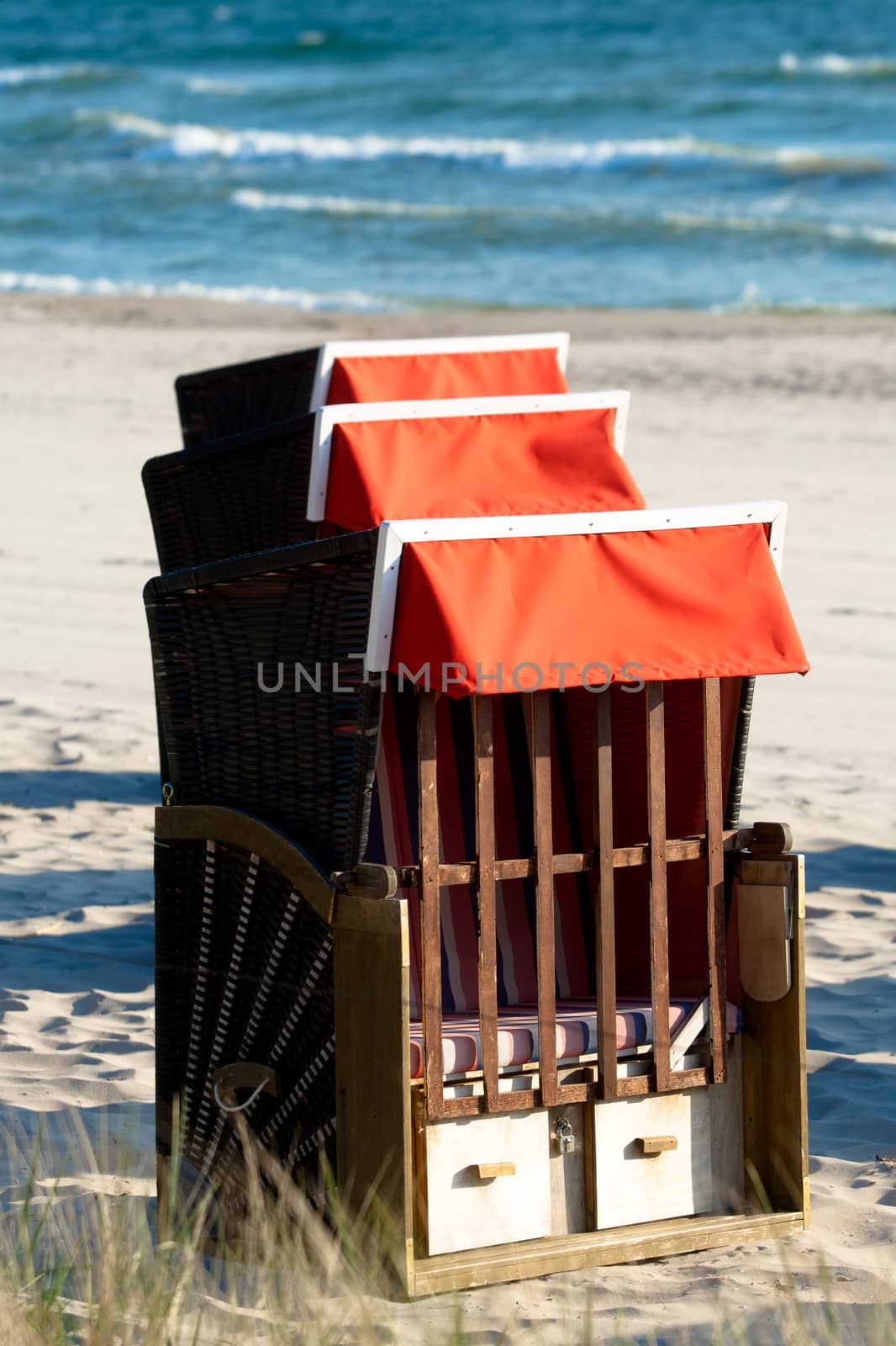 Strandkorb, Strandkoerbe in Rugen, Germany, Beach chairs on the sandy beach in Binz